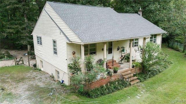 view of front of home with a porch and a front lawn