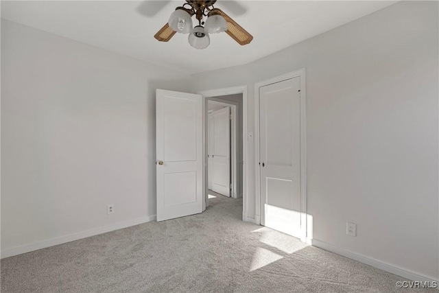 carpeted empty room with ceiling fan