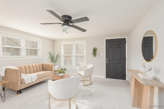 living room featuring light carpet and ceiling fan