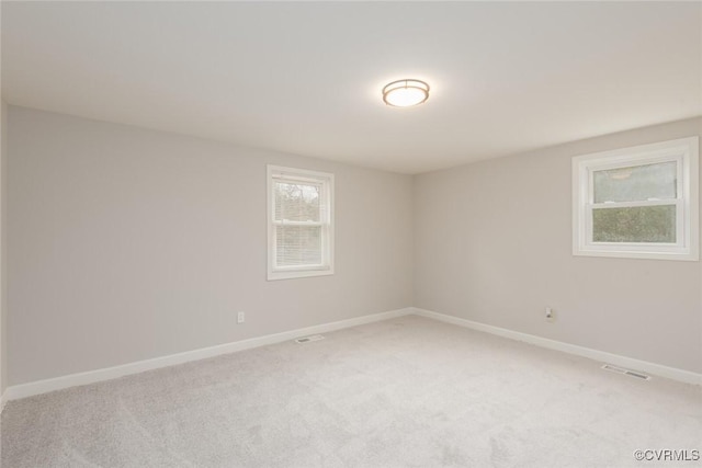 unfurnished room with carpet flooring