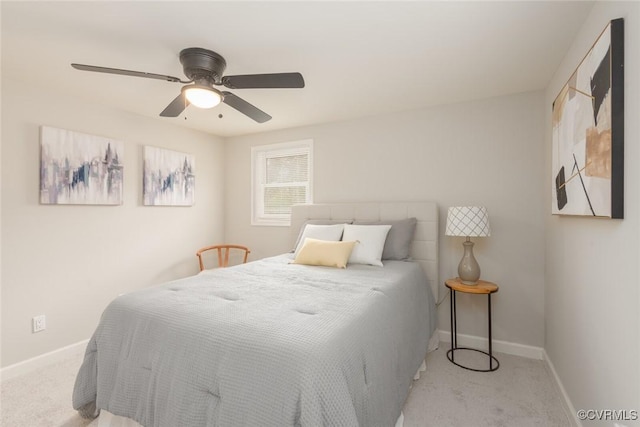 bedroom with light colored carpet and ceiling fan