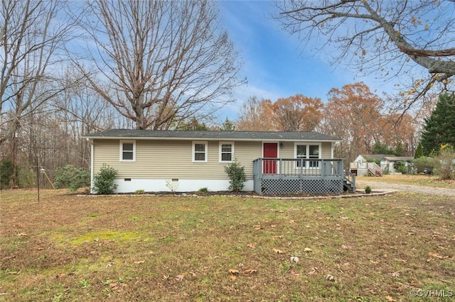 view of front of house with a front lawn and a deck