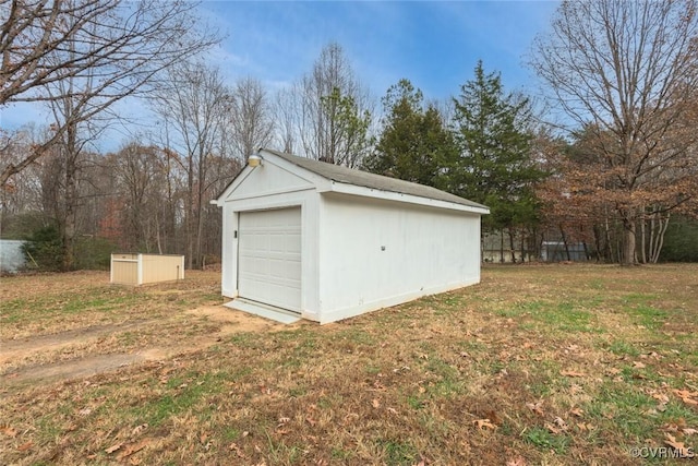 garage with a lawn