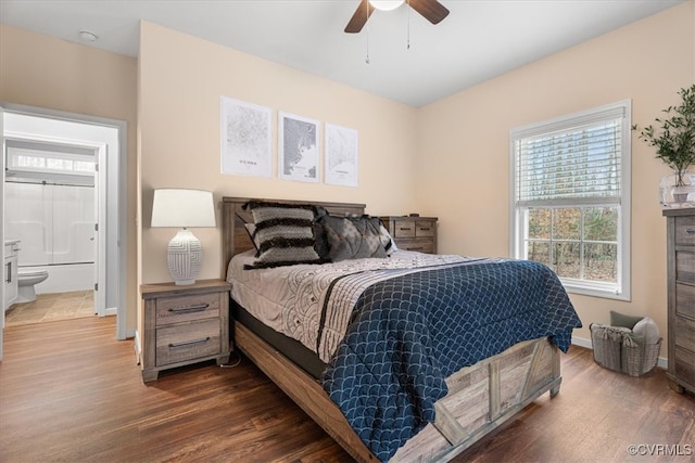 bedroom with ceiling fan and dark hardwood / wood-style flooring