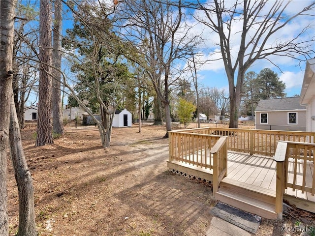 wooden terrace with a shed