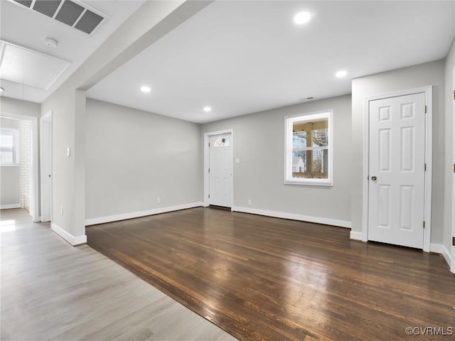 interior space featuring a wealth of natural light and dark hardwood / wood-style floors