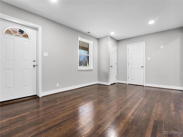 entrance foyer featuring dark hardwood / wood-style flooring