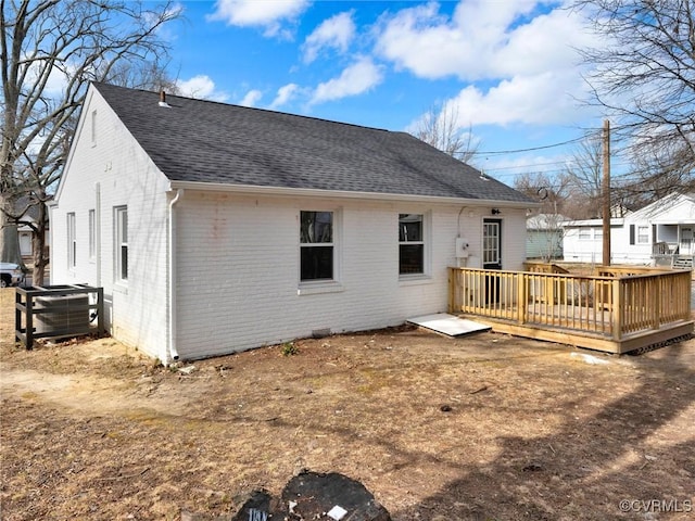 back of property with a wooden deck