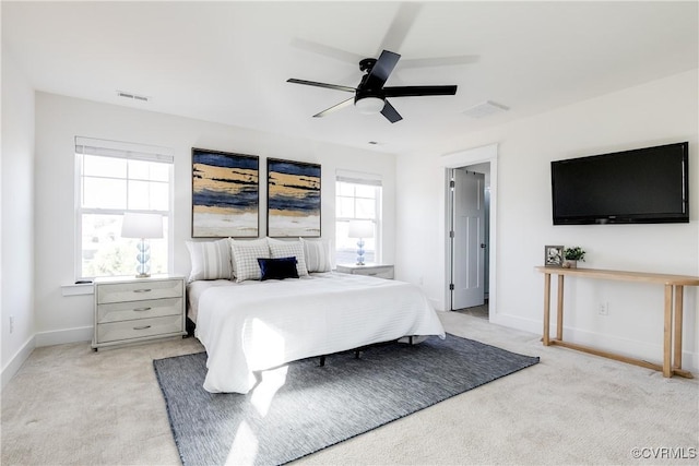 bedroom with light carpet and ceiling fan