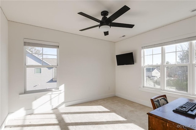 carpeted office with ceiling fan