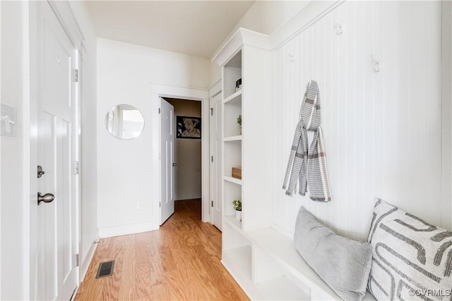 mudroom with light hardwood / wood-style flooring