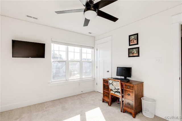 office area featuring ceiling fan and light carpet