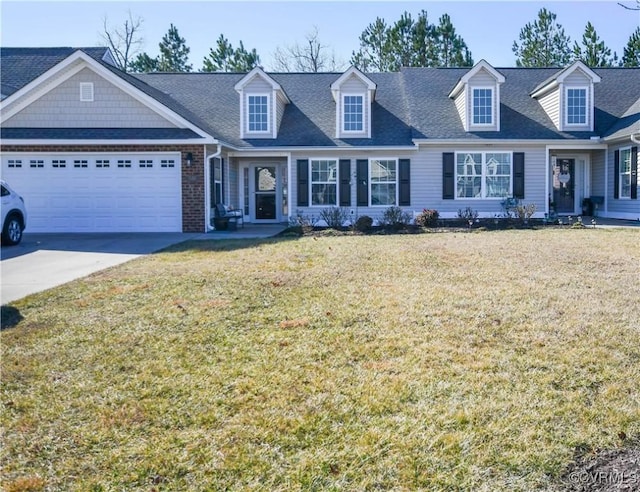 new england style home featuring a garage and a front yard