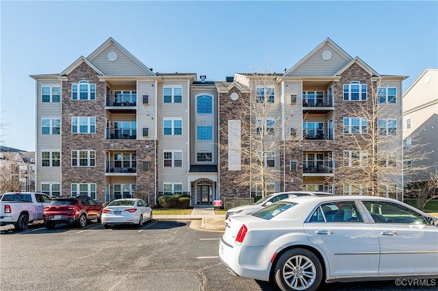 view of property featuring uncovered parking