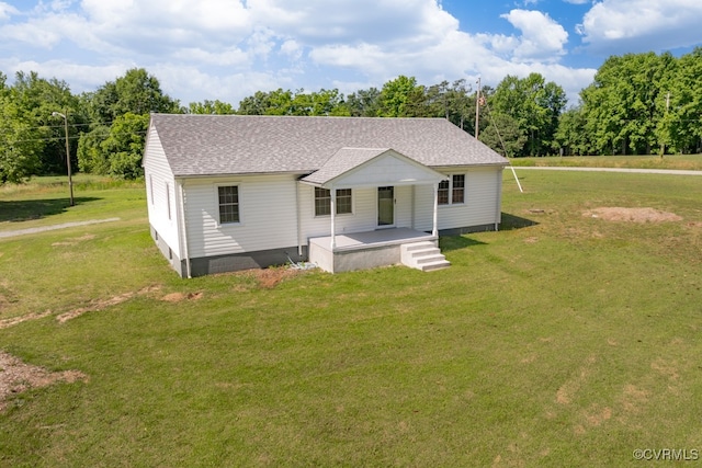 view of front facade with covered porch and a front lawn