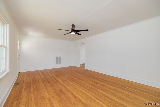 spare room featuring ornamental molding, ceiling fan, and light hardwood / wood-style flooring