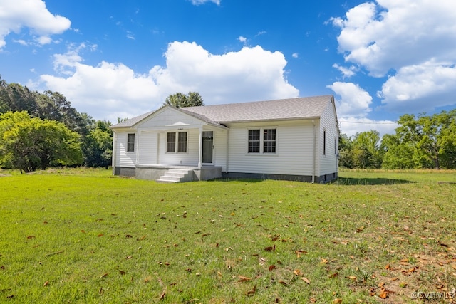 back of property with a yard