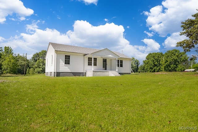 back of house with a porch and a lawn