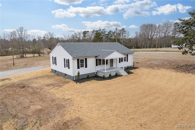 view of front of home featuring roof with shingles