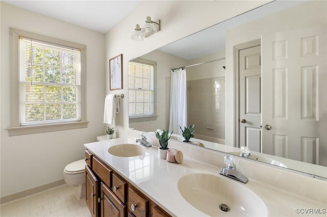 full bathroom featuring shower / tub combo, toilet, vanity, and tile patterned flooring