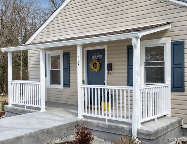 property entrance with covered porch