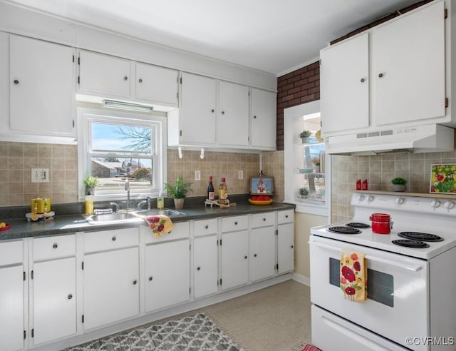 kitchen featuring under cabinet range hood, white electric stove, white cabinetry, and a sink