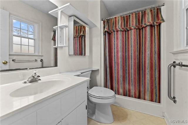 full bathroom featuring toilet, tile patterned floors, vanity, and a shower with curtain