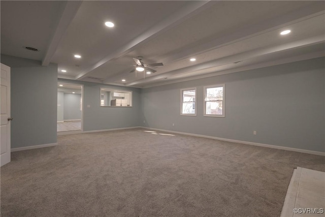 empty room featuring ceiling fan, beam ceiling, and carpet