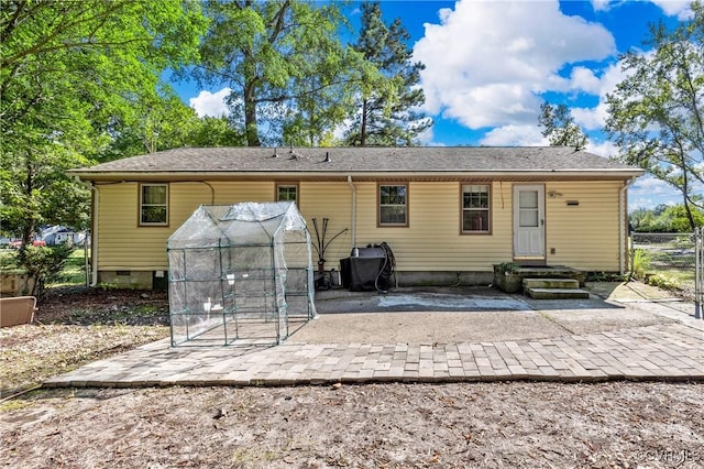 rear view of property with a patio