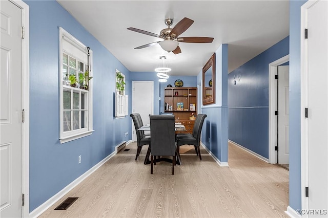 dining area featuring ceiling fan and light hardwood / wood-style flooring