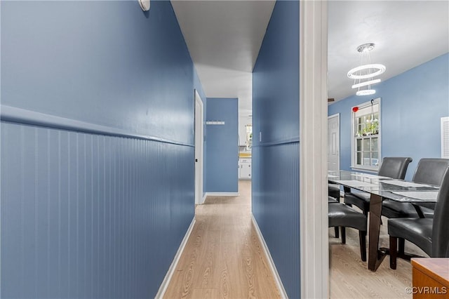 corridor featuring light hardwood / wood-style floors