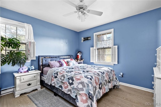 bedroom featuring hardwood / wood-style floors and ceiling fan