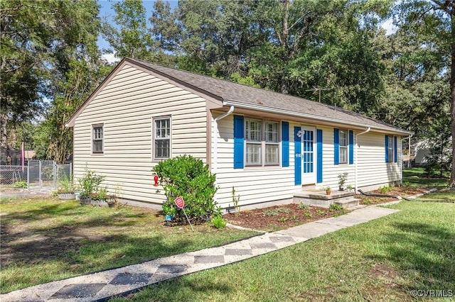 ranch-style home with a front yard