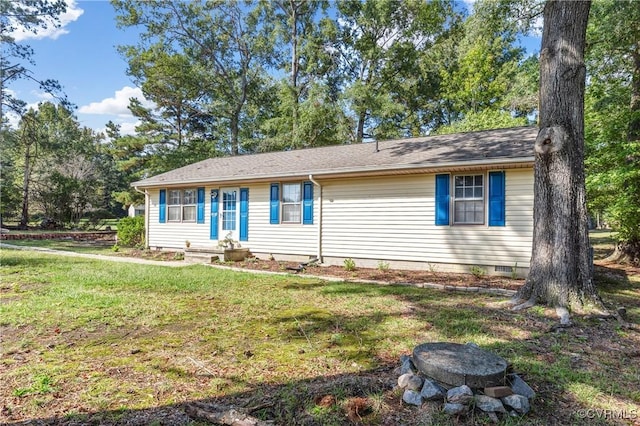 ranch-style home with a front lawn