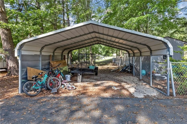 view of vehicle parking featuring a carport