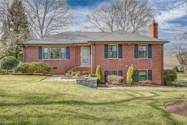 view of front of property with a front yard, crawl space, brick siding, and a chimney