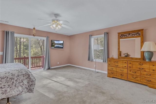 bedroom featuring access to exterior, ceiling fan, and carpet