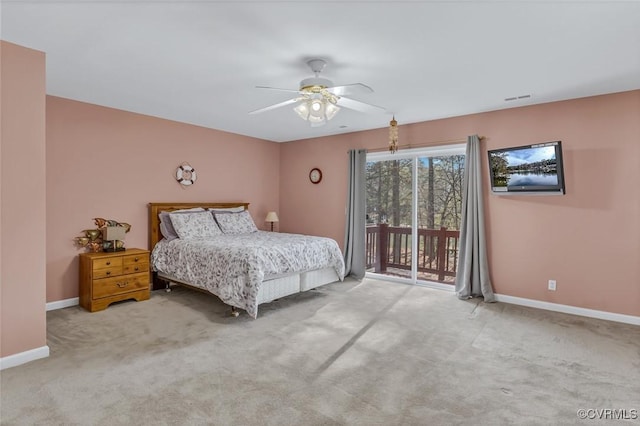 bedroom featuring light carpet, access to outside, and ceiling fan