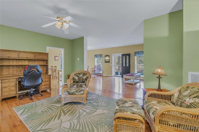 interior space with light hardwood / wood-style flooring and ceiling fan