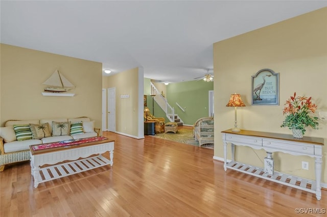 interior space with hardwood / wood-style floors and ceiling fan