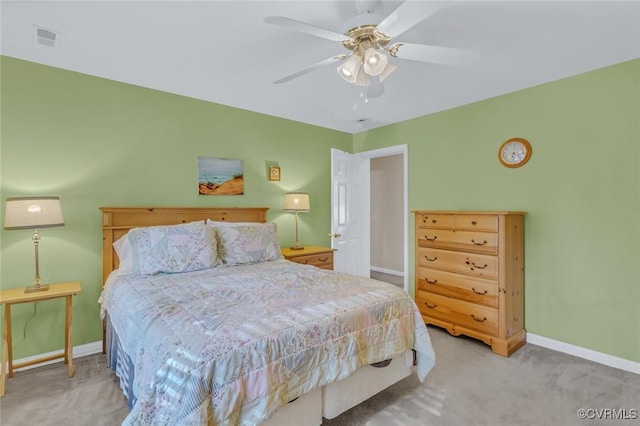 bedroom with light carpet and ceiling fan