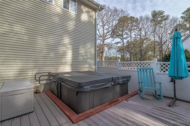 deck with a hot tub