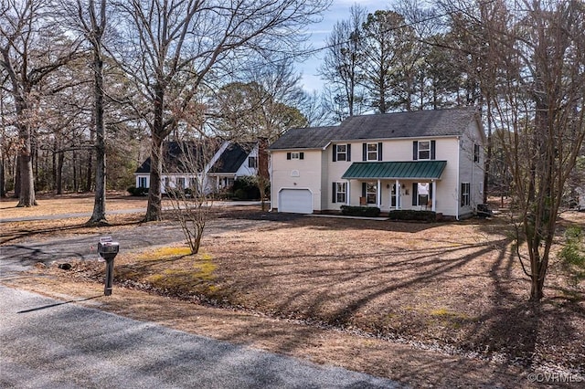 view of front of home with a garage and a porch