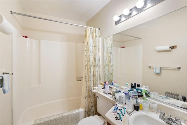 bathroom with toilet, shower / bath combination with curtain, and vanity