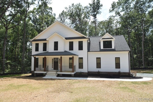 view of front of property with a porch and a front yard