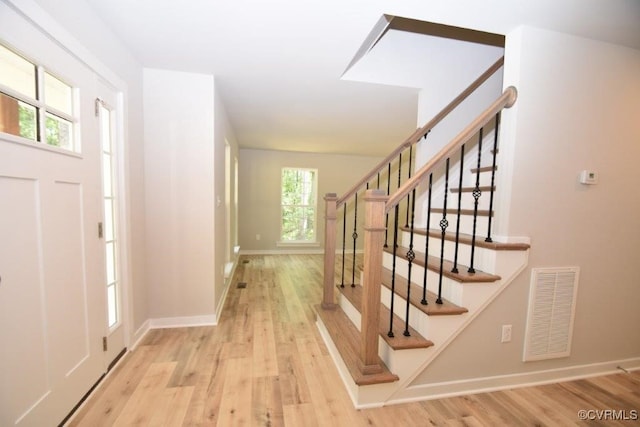 foyer with light hardwood / wood-style floors