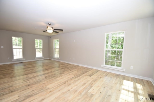 spare room featuring ceiling fan and light wood-type flooring