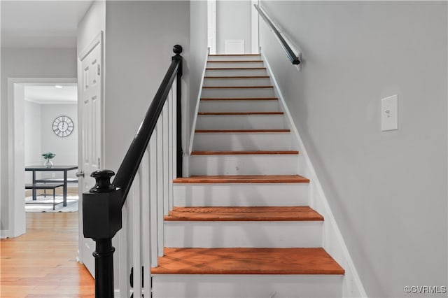 staircase featuring hardwood / wood-style floors