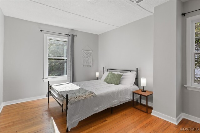 bedroom with light wood-type flooring