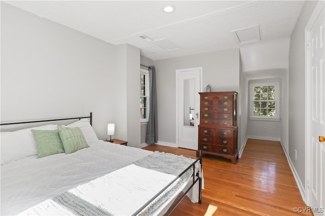 bedroom with hardwood / wood-style flooring